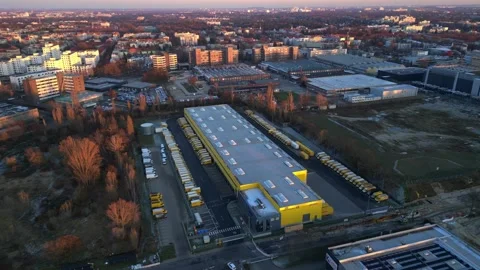 Long yellow DHL distribution center Berlin. Lovely aerial view flight drone Stock Footage 321821453
