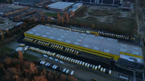 Long yellow DHL distribution center Berlin. Perfect aerial view flight drone Stock Footage 321821544