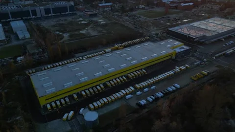 Long yellow DHL German Post distribution center in Berlin. Magic aerial view Stock Footage 322186915