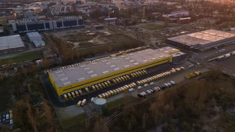 Long yellow DHL German Post distribution center in Berlin. drone Stock Footage 322186927