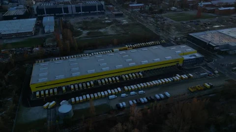 Long yellow DHL German Post distribution center in Berlin. Great aerial view Stock Footage 322186967