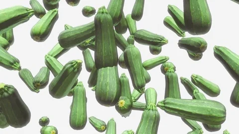 Long Zucchinis Floating on a White Background 库存影片 72299630