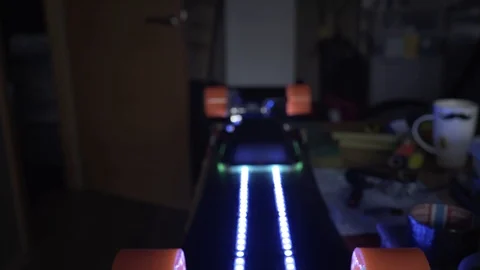 Longboard with LED light illumination. Assembling skateboard with motor. Carbon Stock Footage 89245251