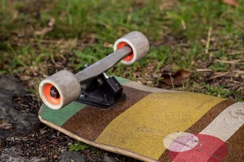 Longboard with white wheels. Stock Photos