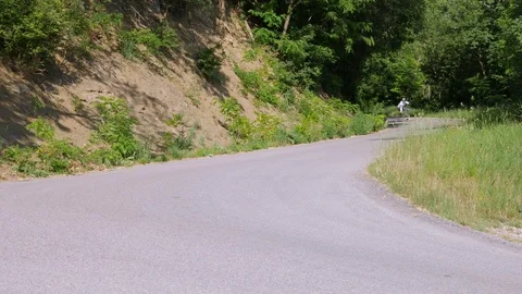 Longboarder does a slide on a longboard skateboard Stock Footage 77171197