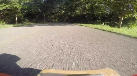 Longboarder going down road fast 2 Stock Footage 53838498