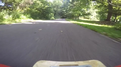 Longboarder going down road fast 3 Stock Footage 53838499