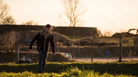 Longboarder side backlight flare gras Stock Footage 153517981