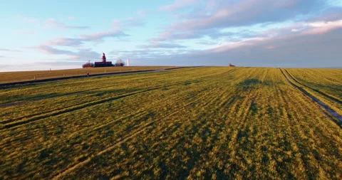Longboarder sidetracking sunset over field 스톡 동영상 153518750