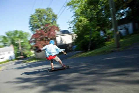 Longboarder Speeding Downhill Stock Photos