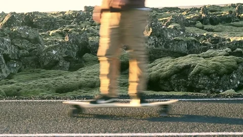 Longboarding on a lava field. Stock Footage 258082442
