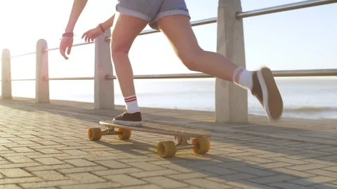 Longboarding by the ocean Stock Footage 118617110