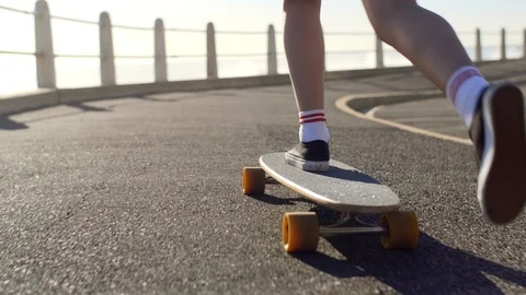 Longboarding on smooth road at sunset Stock Footage 118608304