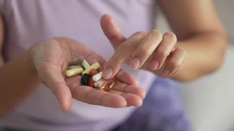 Longevity anti-aging medication for asia woman. Menopause awareness diagnosis Vidéo 304777597