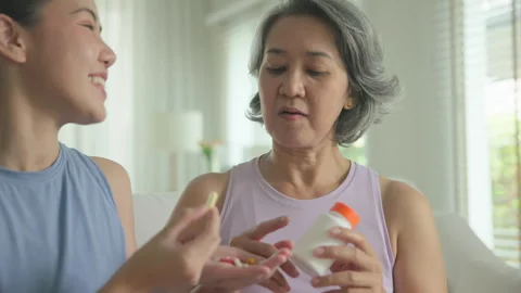 Longevity anti-aging medication for asia woman. Menopause awareness diagnosis Stock Footage 306196374