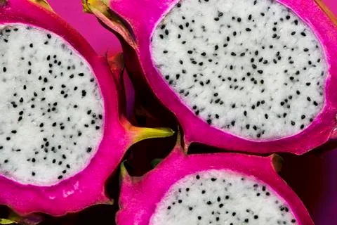 Longitudinal section of a ripe dragon fruit Stock Photos