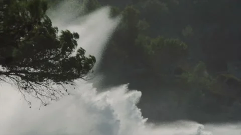 Longshot of massive ocean spray hitting Mediterranean coast surrounded by pin Stock Footage 168774380