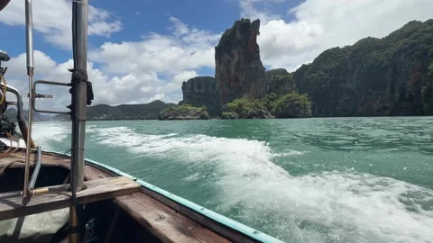 Longtail Boat Passing Limestone Cliffs in Thailand Stock Footage 346665205