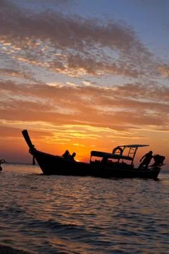 Longtail boat at sunset Stock Photos