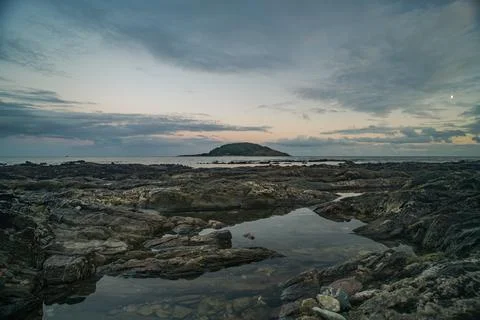 Looe Island seascape at dusk with dramatic clouds over the sea in Cornwall Фото