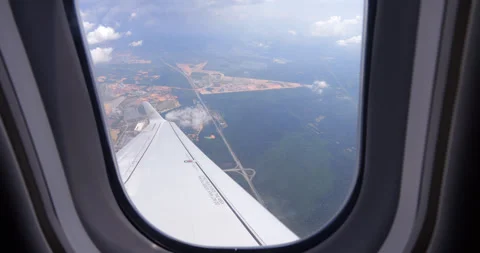 Look from airplane to Gamuda Cove development area and Cyberjaya Stock Footage 319638433