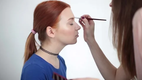 The look and the scene of how I do makeup and visage, paint lips, eyes Stock Footage 129737034