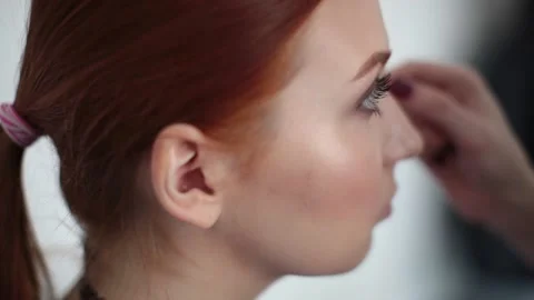 The look and the scene of how I do makeup and visage, paint lips, eyes Stock Footage 129737138