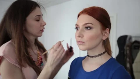 The look and the scene of how I do makeup and visage, paint lips, eyes Stock Footage 129737199
