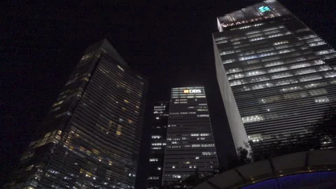 Look up angle night marina bay financial center office buildings lights Stock Footage 151459909