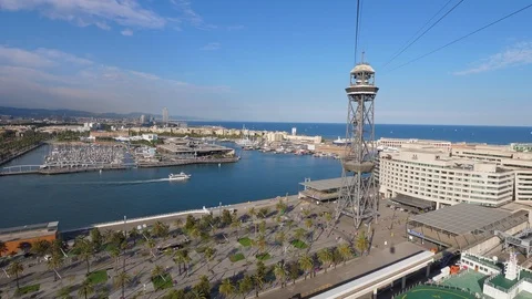 Look back from cable car, aerial perspective of Moll de Barcelona and Port Vell Stock Footage 102284425
