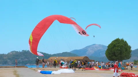 Look at beach with paragliding. Video stock 260353599