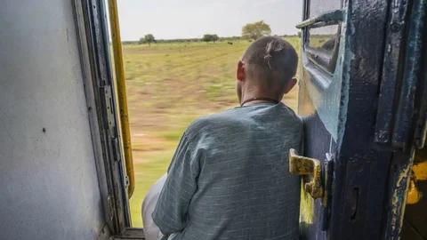 A look from behind on a man inside India train, 4k time lapse footage Stock Footage 83729015
