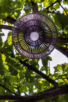 Look from bottom view of Brown lantern lamp of woven bamboo hanging. Stock Photos