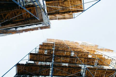 Look up at the construction site against the backdrop of scaffolding Stock Photos