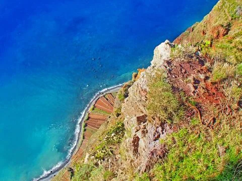 Look in depth at the high and steep rock walls of the island Madeita Stock Photos
