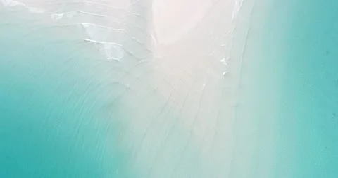 Look down aerial view of tri angle sea beach waves of turquoise water on beach Stock Footage 134327650