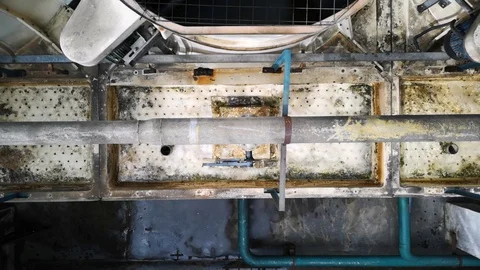 Look down. Condenser water out of the pipes for the purpose of eliminating heat Stock Footage 95160087