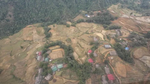 Look down at small village and terrace rice fields in Sapa Видео 295086503