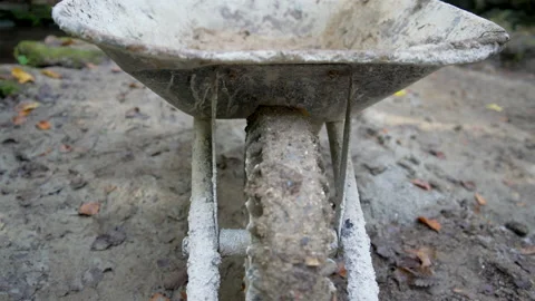 Look into an empty wheelbarrow at construction site Stock Footage 158976986