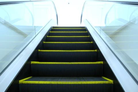 Look up the escalator from the ground below. Stock Photos