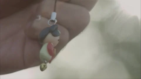 Look at the hanging chain in your hand Stock Footage 261509953