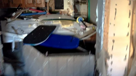 A look inside a devastated apartment full of sand and debris after Hurricane Video stock 93439753