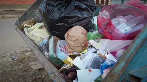 A look inside a rusty garbage can filled with garbage bags Stock Footage 194395216