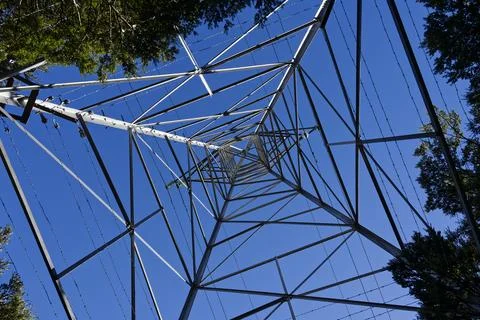 Look up, looking up the middle of a transmission tower Stock Photos