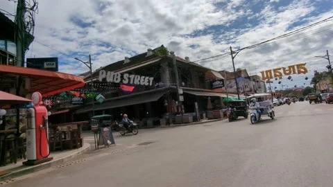Look up low angle pub street pass by in tuk tuk daytime Видео 224803782