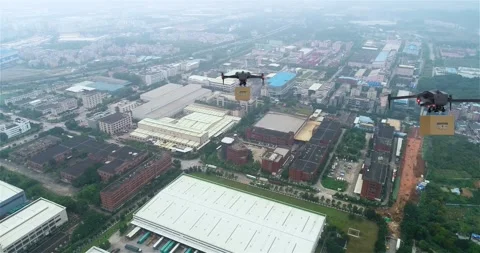A Look At The Next Generation Of Cities. A delivery drone flies over a city and Video stock 309913730