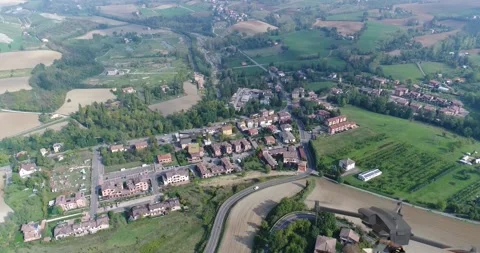 A Look At The Next Generation Of Cities. A delivery drone flies over a city and Видео 310544077