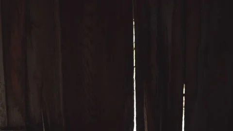 Look out through the window of the old barn / Wall to window Stock Footage 130886274