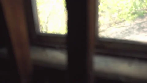 Look out through the window of the old barn / Hand held 動画素材 130886384