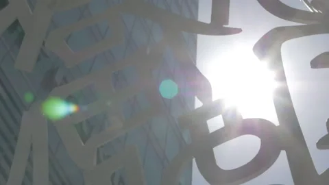 Look up pan right sun flare statue artwork Stock Footage 229278740